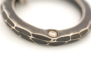 Sterling Silver Circle Pendant with a Champagne Diamond