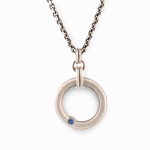Sterling Silver Circle Pendant with a Sapphire