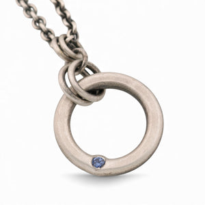 Sterling Silver Circle Pendant with a Sapphire