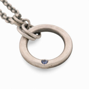 Sterling Silver Circle Pendant with a Sapphire