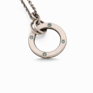 Sterling Silver Circle Pendant with Blue Diamonds