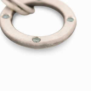 Sterling Silver Circle Pendant with Blue Diamonds