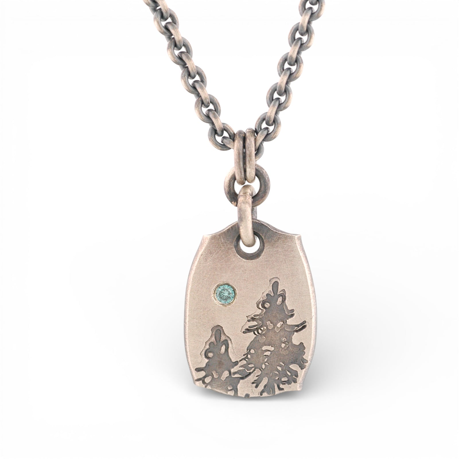 Sterling Silver Pendant with Pine Trees and a Blue Diamond