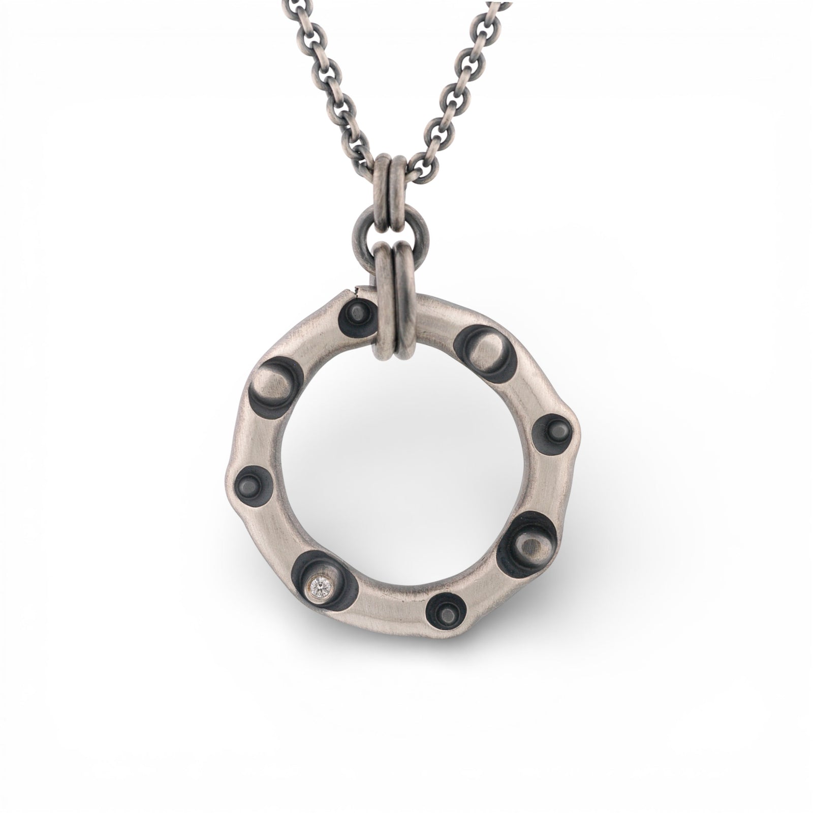 Sterling Silver Circle Pendant with a Diamond
