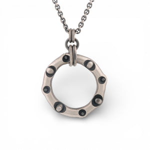 Sterling Silver Circle Pendant with a Diamond