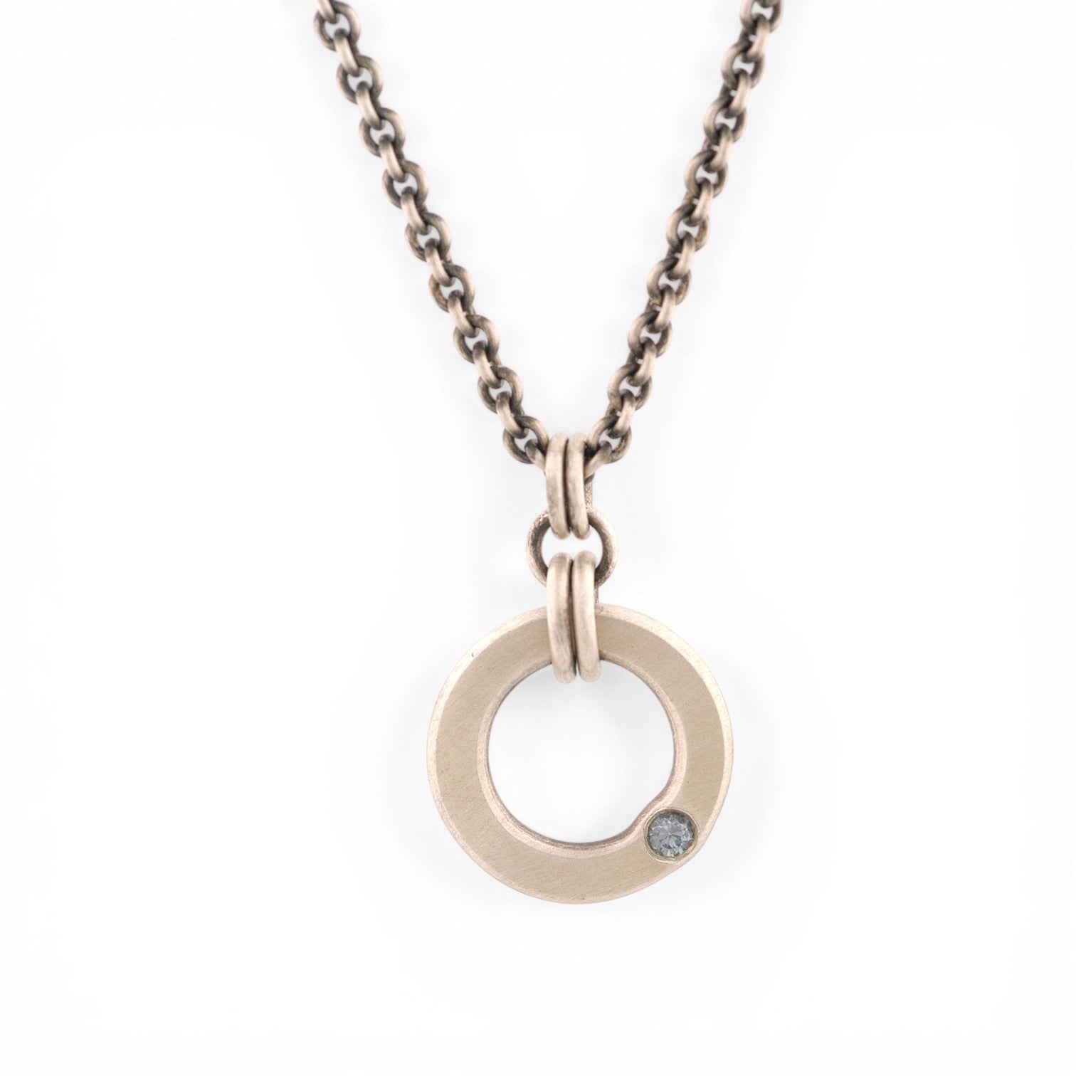 Sterling Silver Circle Pendant with a Montana Sapphire