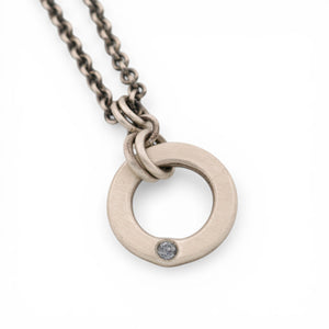 Sterling Silver Circle Pendant with a Montana Sapphire