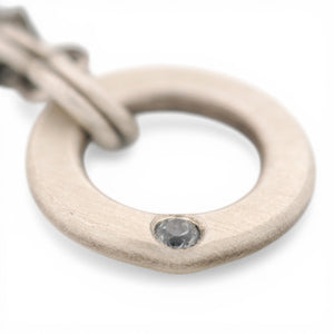 Sterling Silver Circle Pendant with a Montana Sapphire