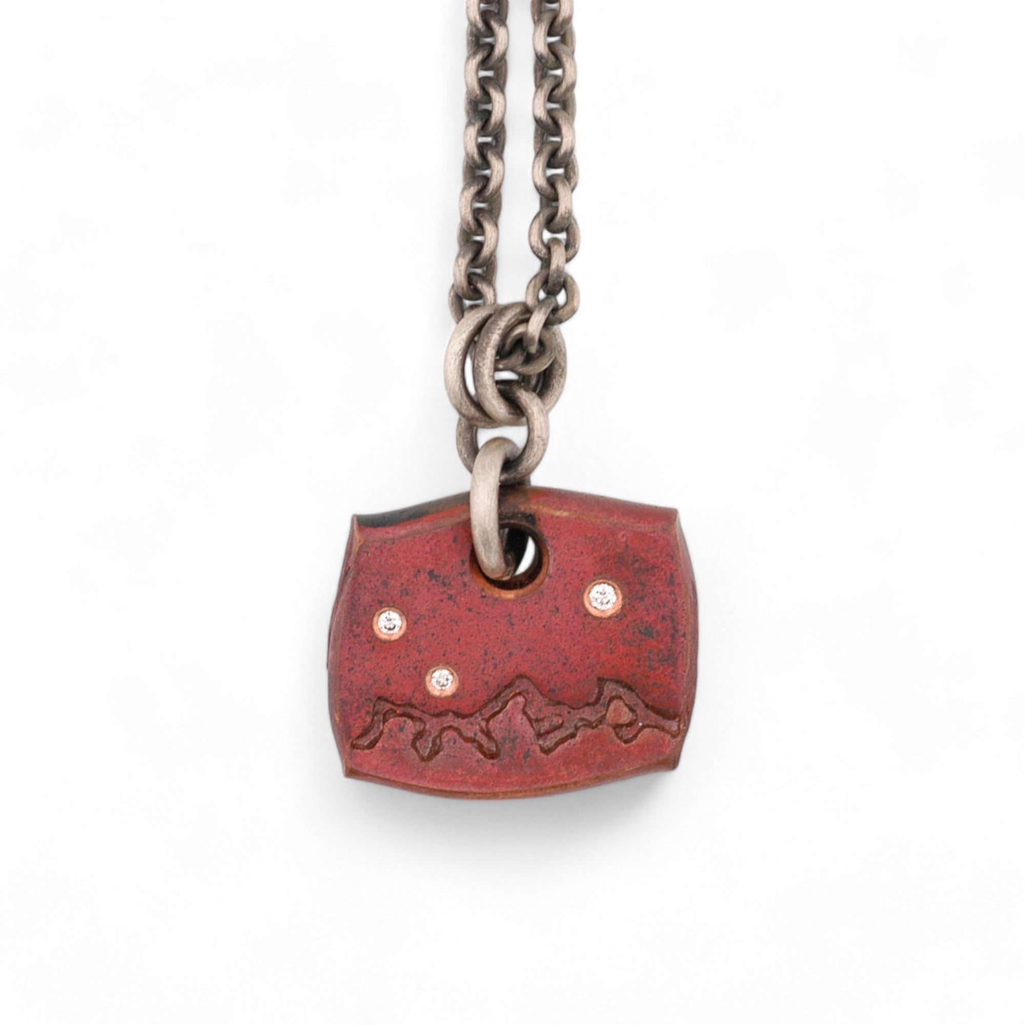 Forged Copper with Mountain Range and Three Diamonds