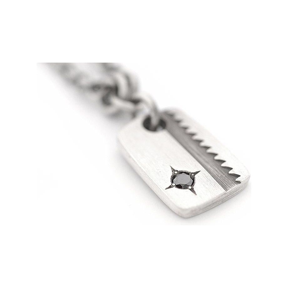 Stamped Saw Blade Pendant with a Black Diamond