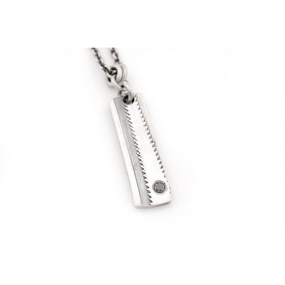 Rectangular Stamped Saw Blade Pendant with a Black Diamond